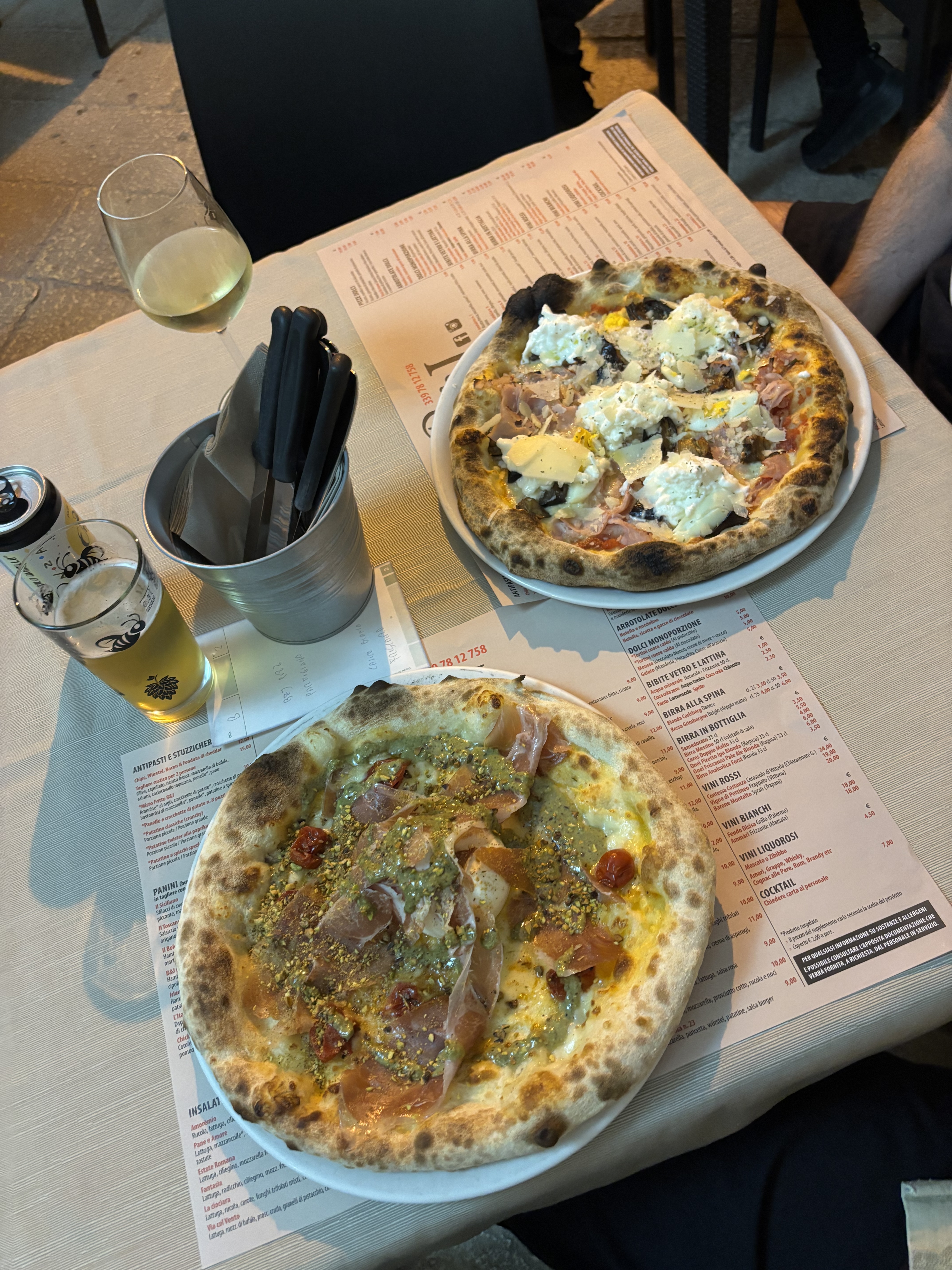 2 pizzas on a table