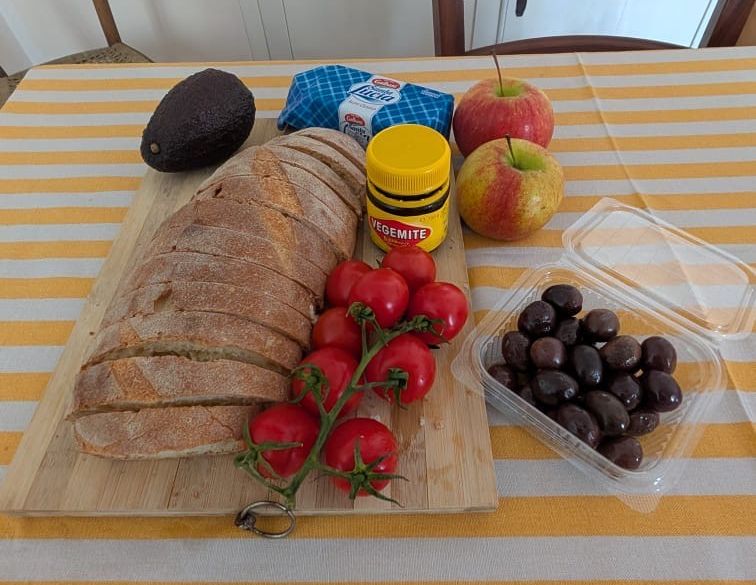 Bread, avos, tomatoes, and vegemite