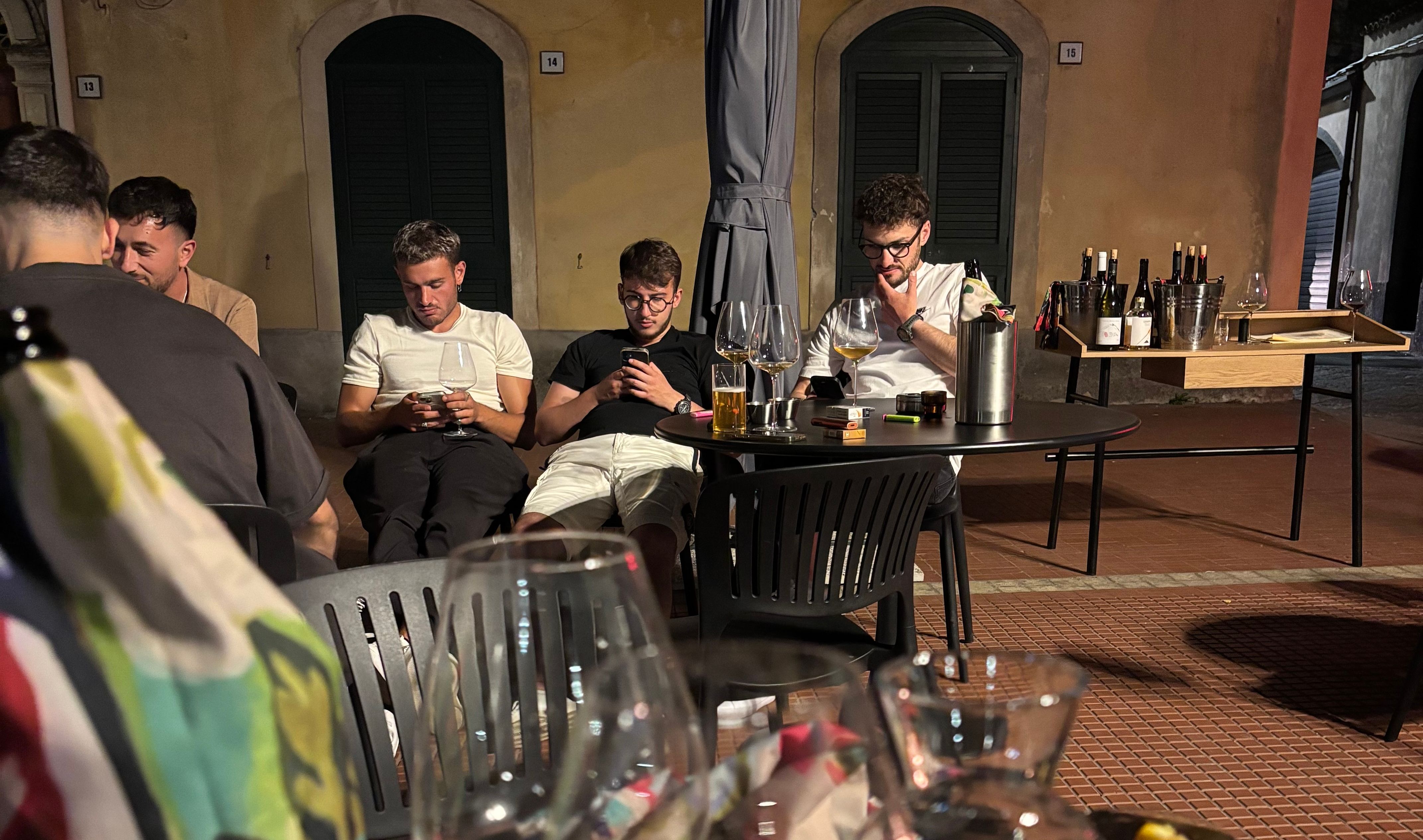 3 men on their phones